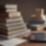 Books stacked on a desk with tax forms and calculators.